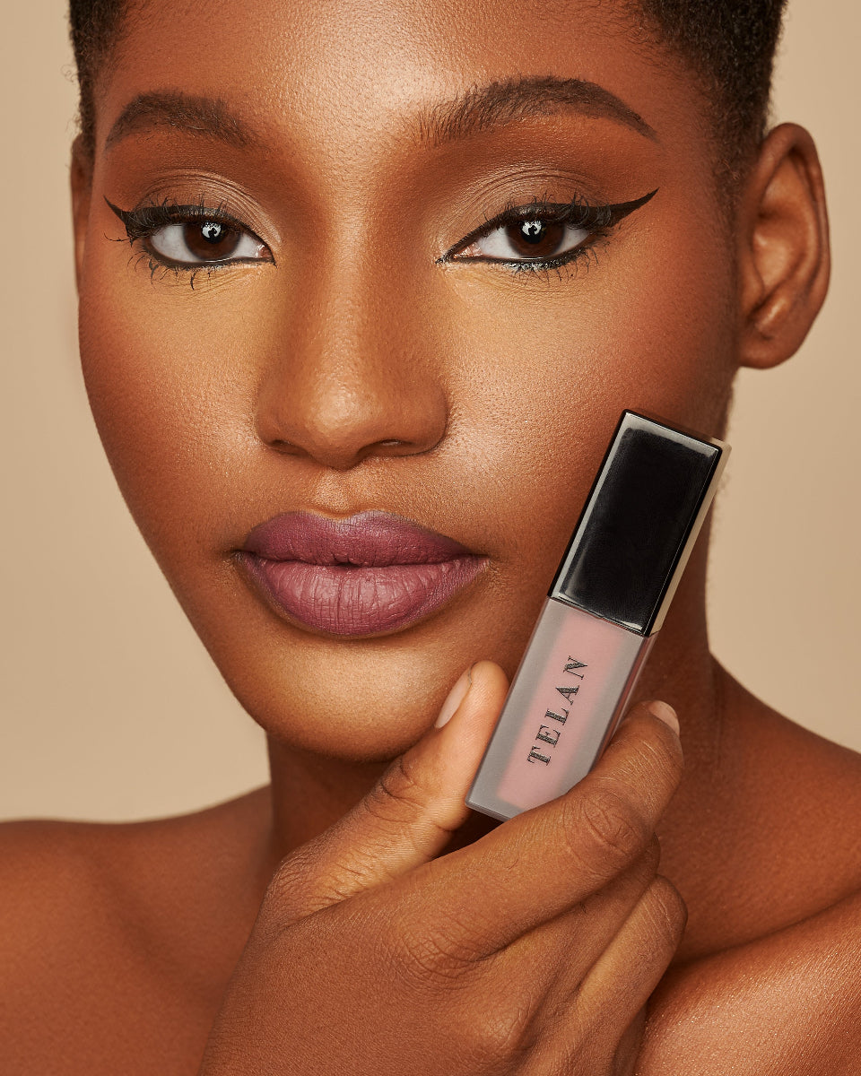 A model holding a Telan Lana Lip stain 